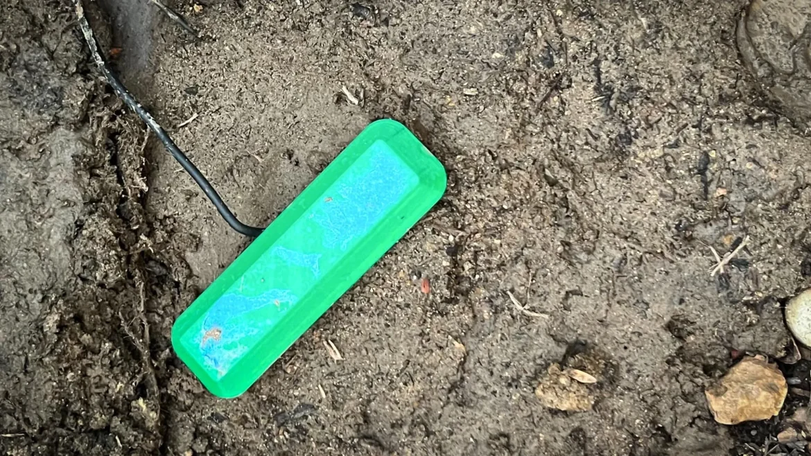 The device uses naturally occurring bacteria to break down organic material in soil and produce a steady electric current