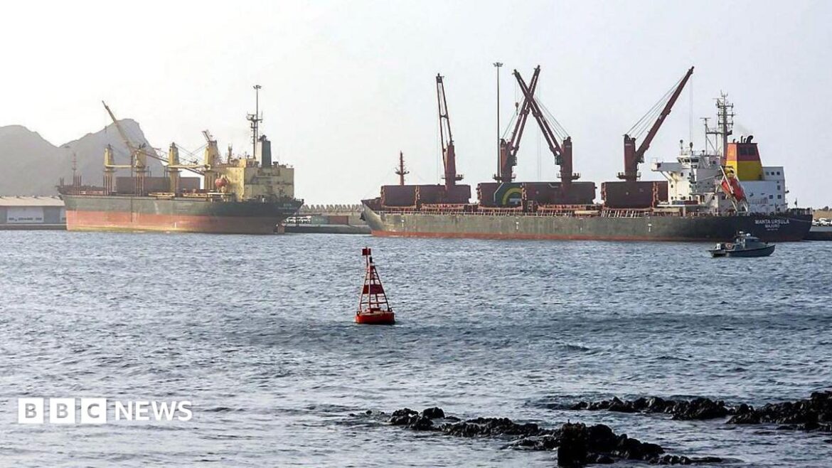 Large cargo ships standing still in ocean water