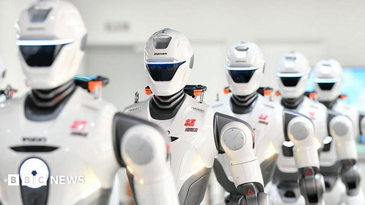 A row of humanoid robots are on display after rolling off the production line at a production facility in China