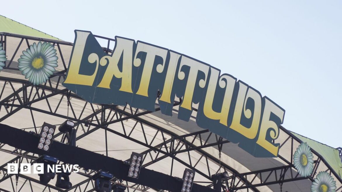 A close-up of the Latitude Festival sign on the top of a stage at the event. The letters are in block capitals, edged in
