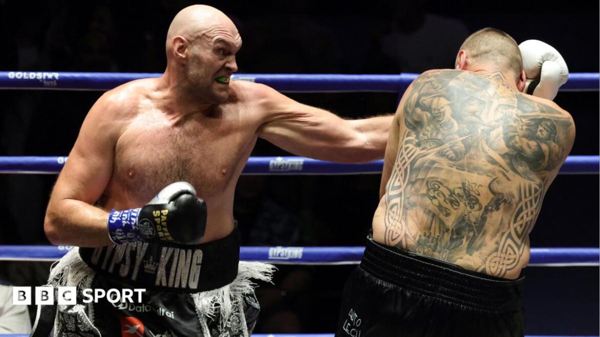 Tyson Fury lands a punch on Mariusz Wach