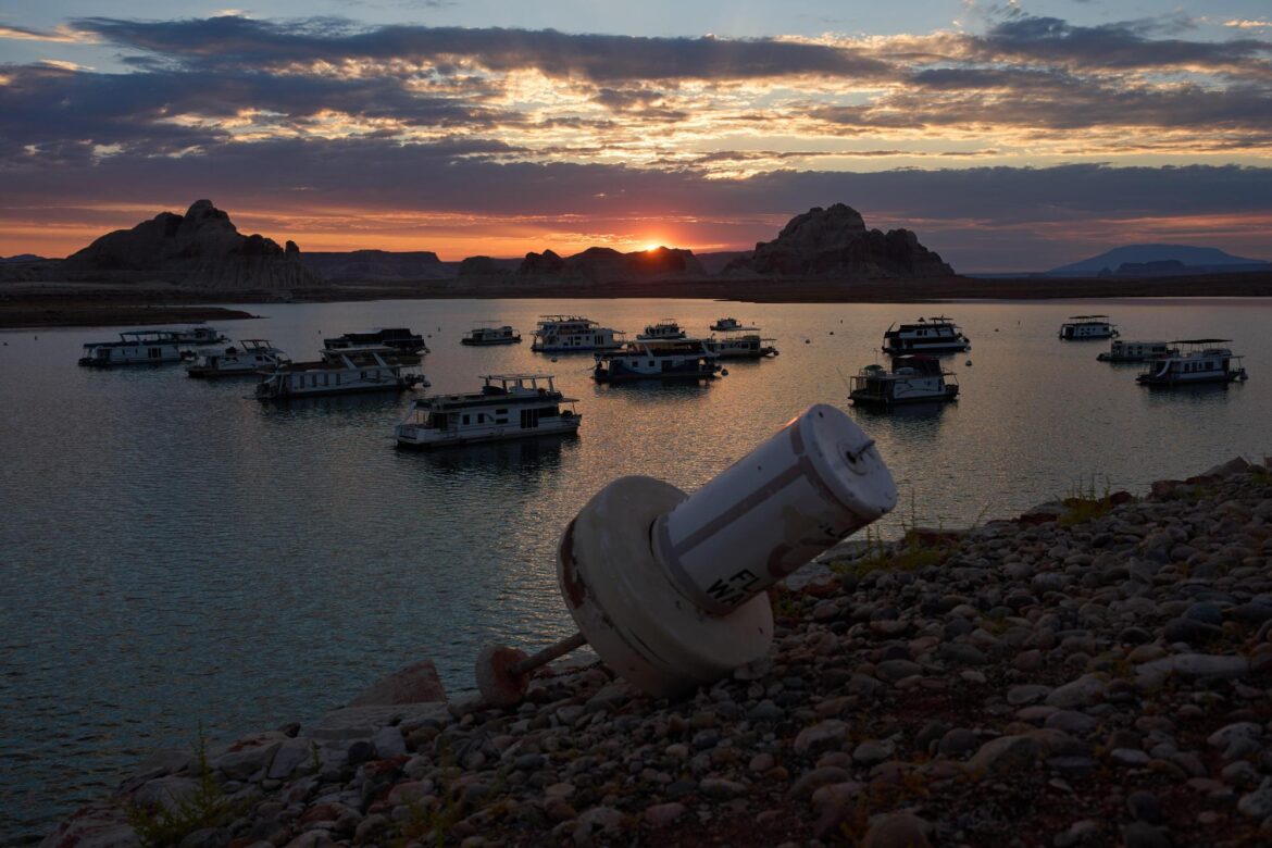 A formerly floating buoy now sits high and dry above Lake Powell