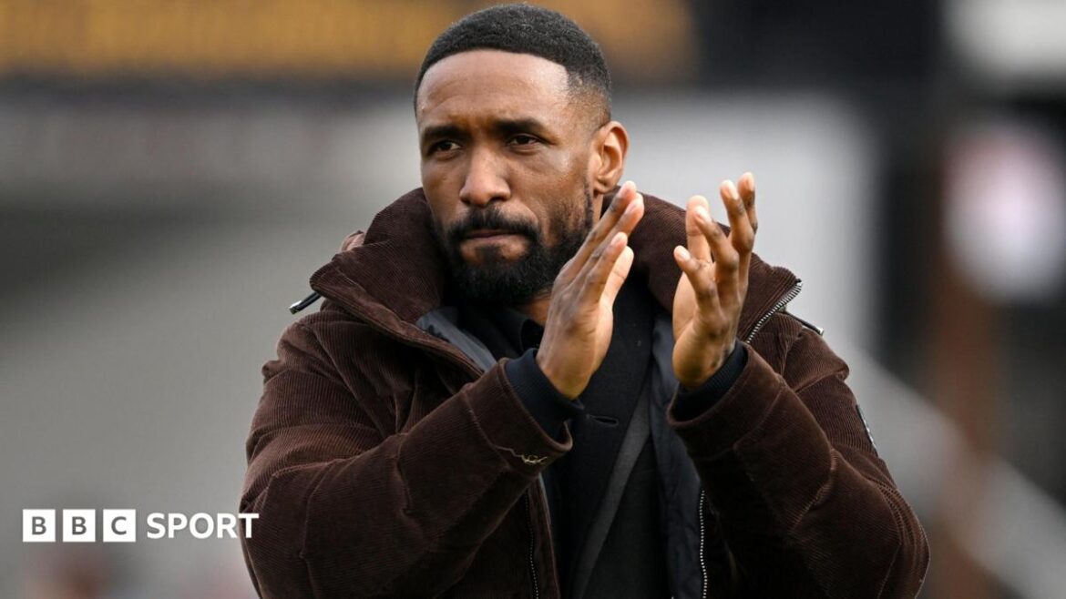 Jermain Defoe, Manager of Woking, applauds the fans after the Enterprise National League match between Woking and Eastleigh