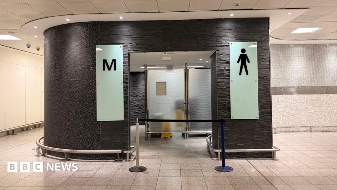 The entrance of a men's toilet which is blocked off