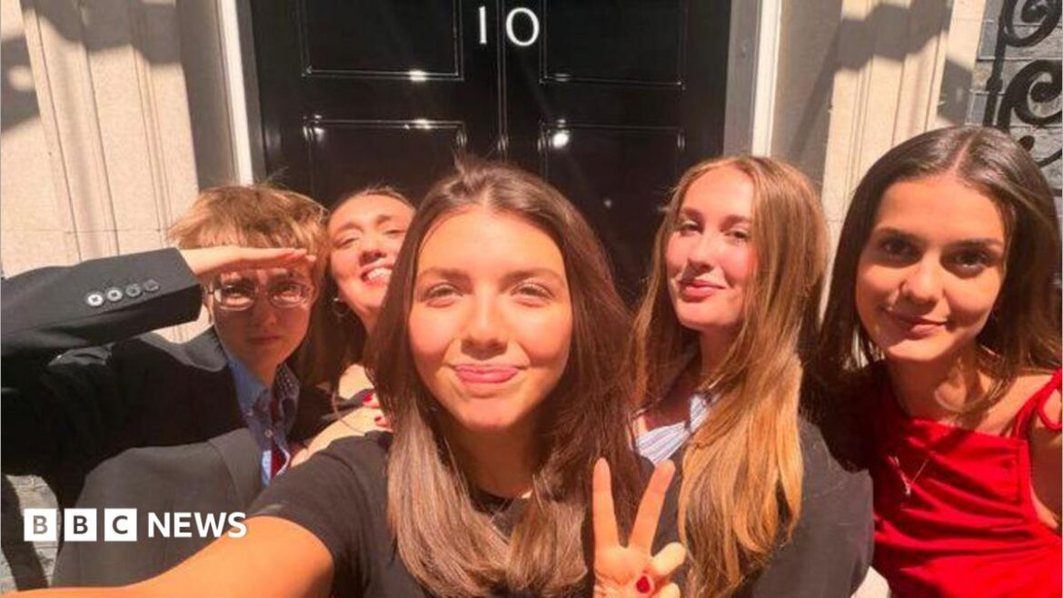 Will, Lottie, Megan, Ellen and Poppy - five young people posing for a picture outside 10 Downing Street