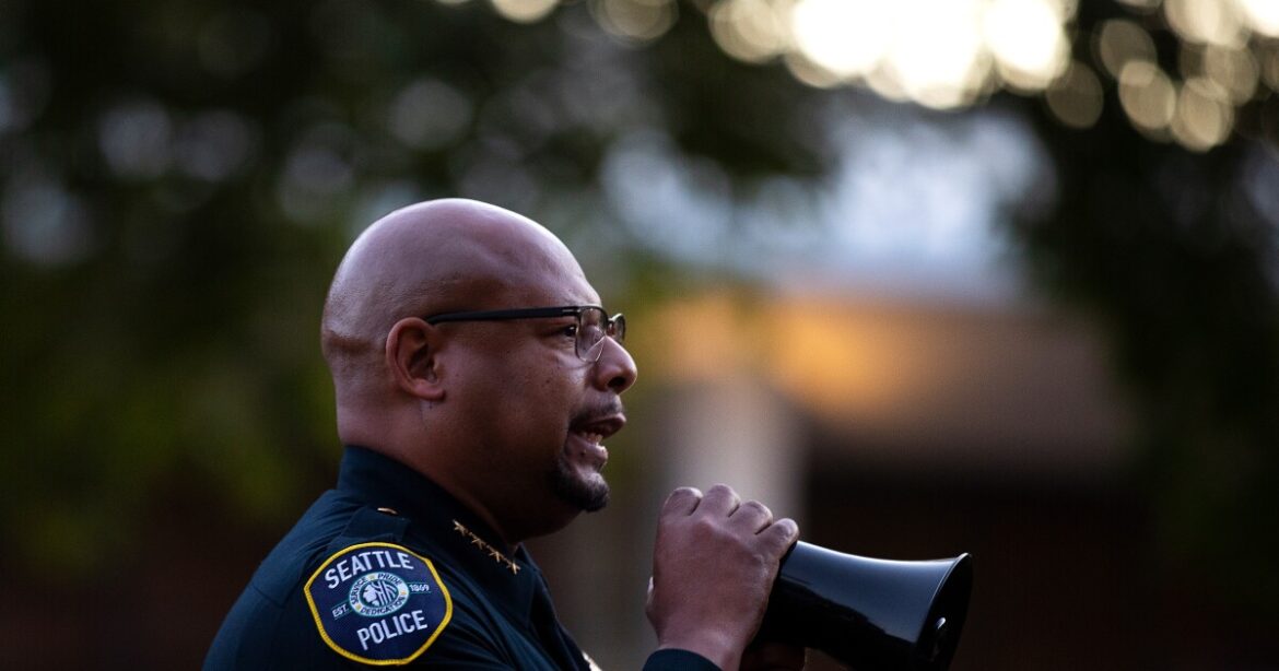 Seattle police chief Shon Barnes speaks to the crowd at a vigil honoring the 3 people who were shot and killed during Bite