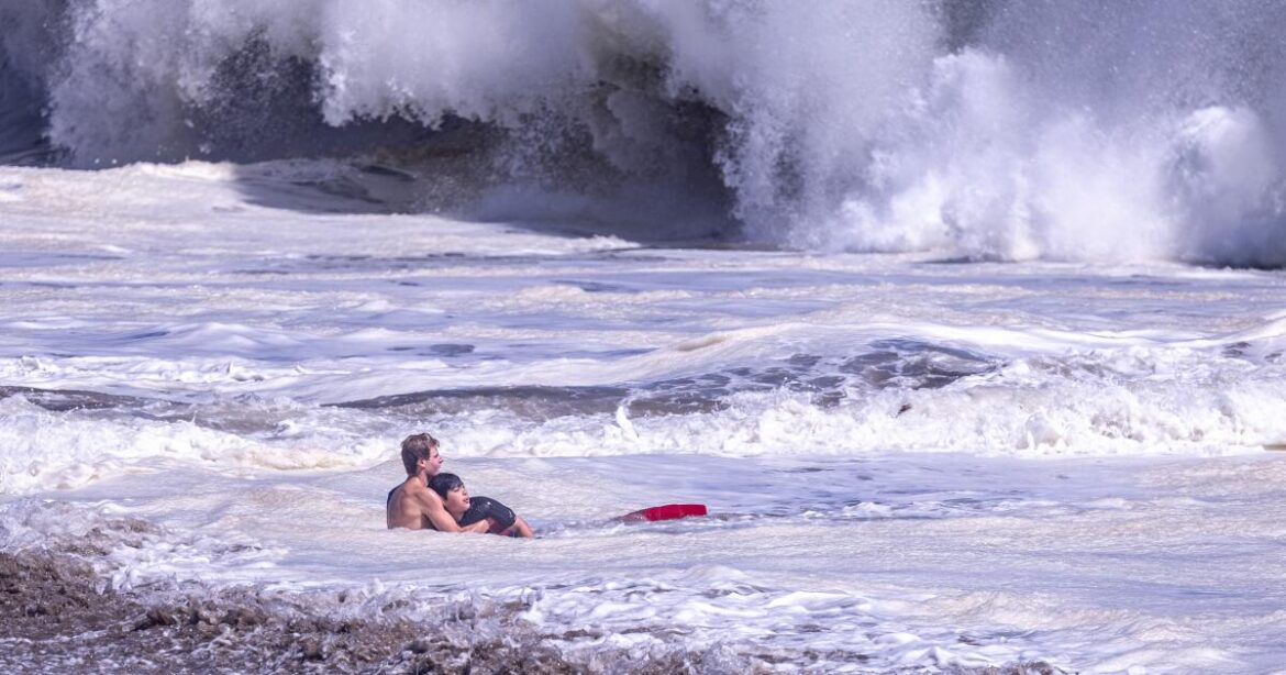 A teenage lifeguard rescued a young boy caught in a suddenly roiled ocean at Seabright State Beach in Santa Cruz on