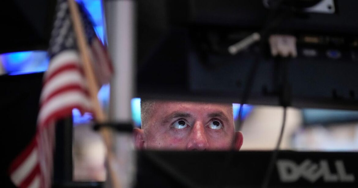 A trader works on the floor of the New York Stock Exchange, Thursday, July 30, 2026, in New York. (AP Photo/Yuki Iwamura)