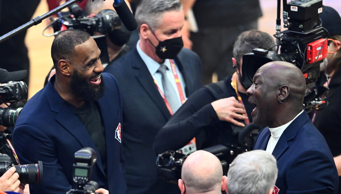 Michael Jordan and LeBron James talk after the presentation of the NBA 75th Anniversary Team during the 2022 NBA All-Star