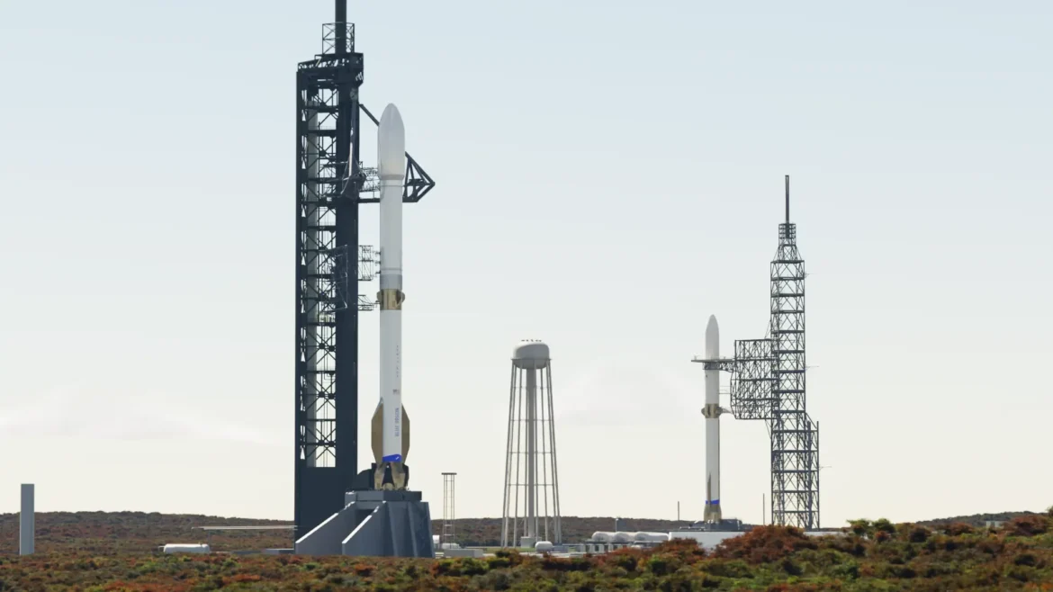 Two rockets stand at neighboring launch towers