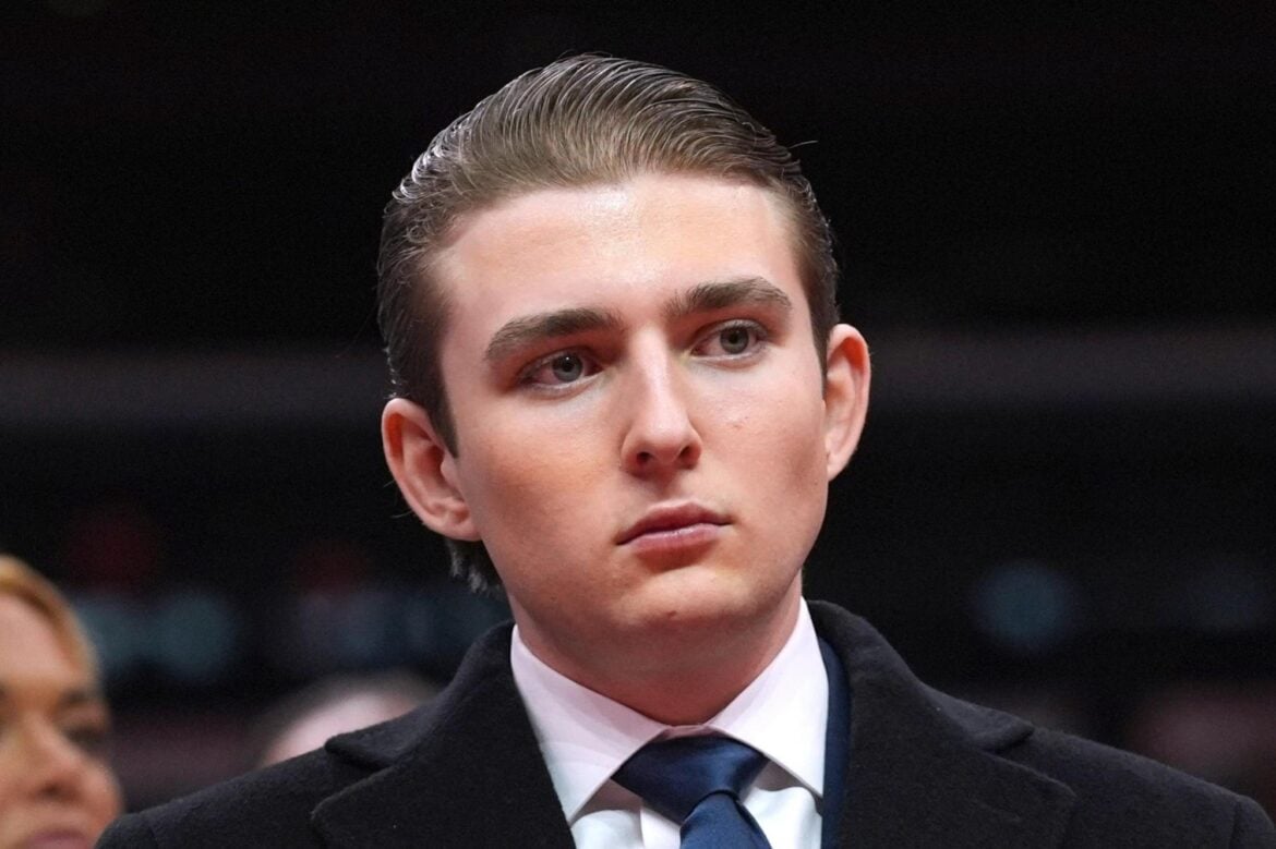 Barron Trump watches as his father, President Donald Trump, attends an event