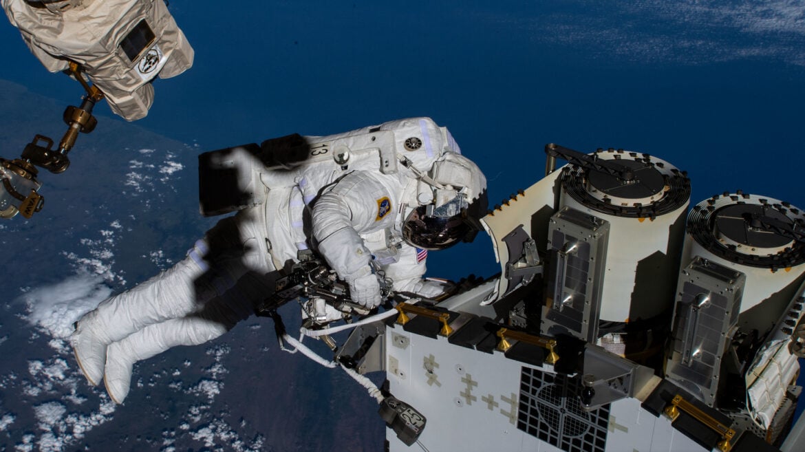 A photo of Expedition 68 Flight Engineer and NASA spacewalker Josh Cassada on Dec. 22, 2022, preparing a roll-out solar