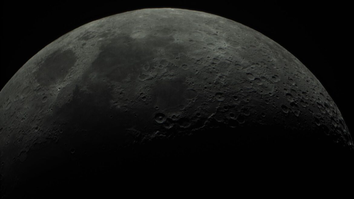 Close telescopic view of the Moon's cratered surface