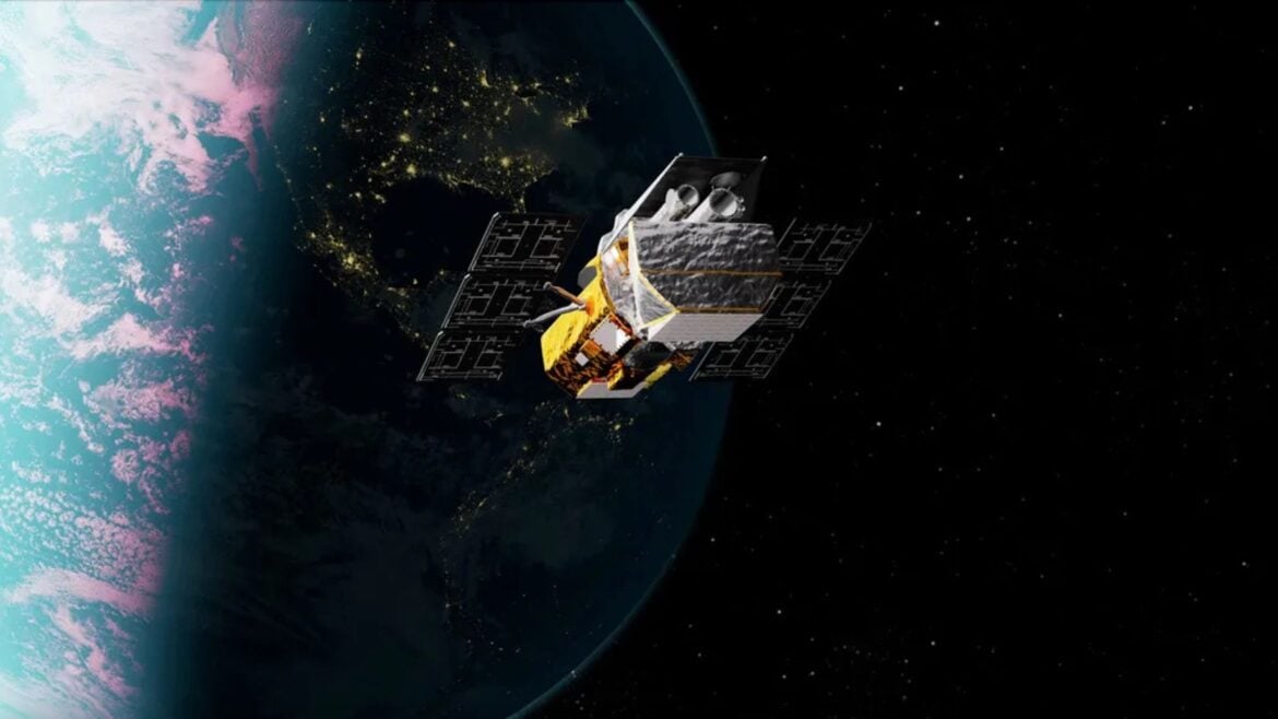 illustration of a gold and silver spacecraft in earth orbit at night