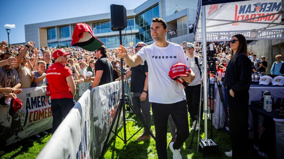 Charlie Kirk hands out hats before he was shot during Turning Point USA’s visit to Utah Valley University in Orem on Sept