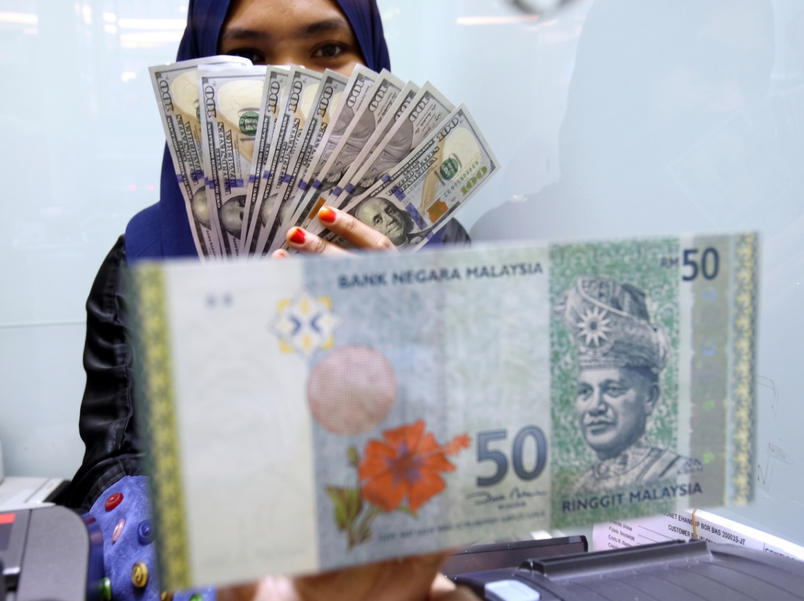 Ringgit Opens Nearly Flat Against US Dollar Amid Global Pressures