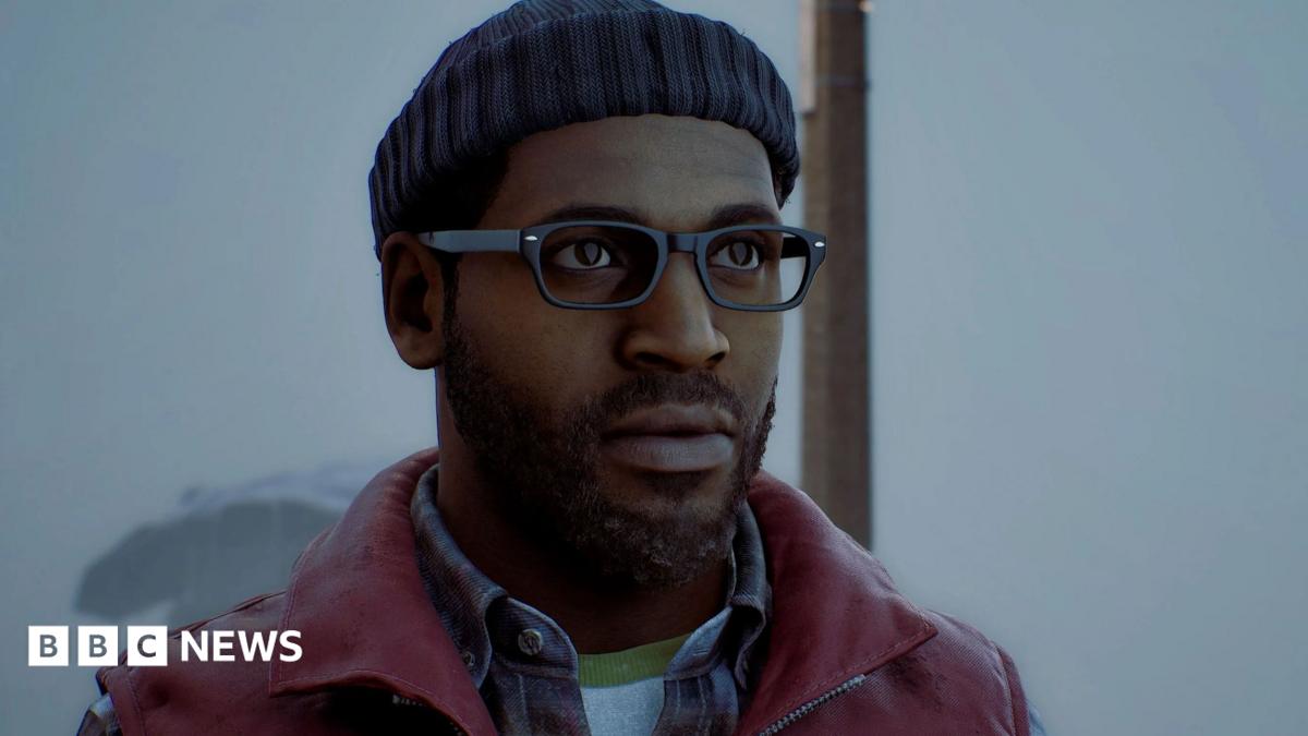 An in-game screenshot of protagonist Simon, wearing a blue beanie and red gilet. He has black glasses and a black beard and