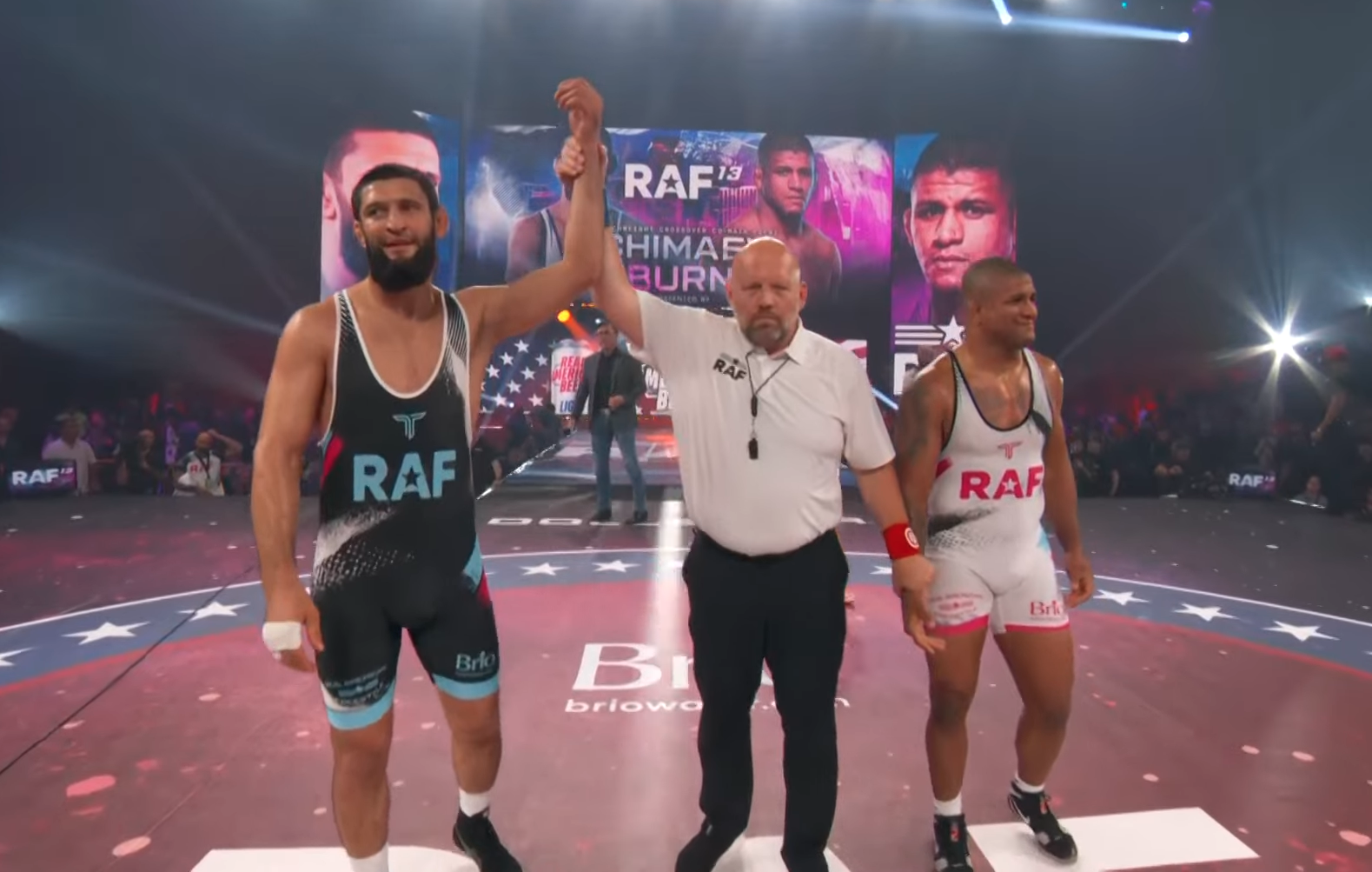 Khamzat Chimaev has his hand raised after beating Gilbert Burns at RAF Wrestling