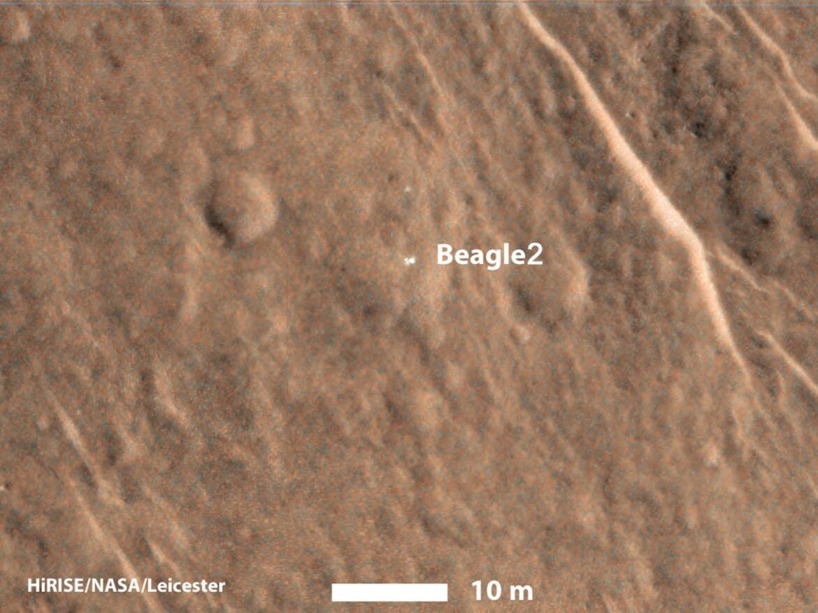 Officials think that the Beagle 2 lander (seen as a bright spot here) partially deployed its solar panels when it reached