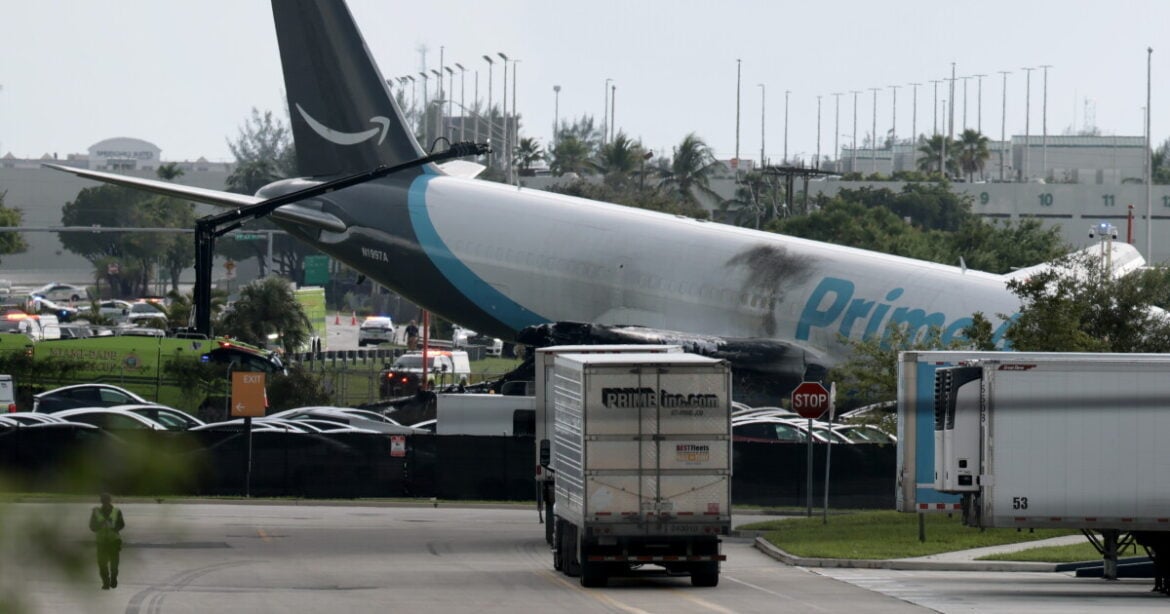 An Amazon cargo plane is seen after it crashed at Miami International Airport on Sunday in Miami, Florida. The Federal