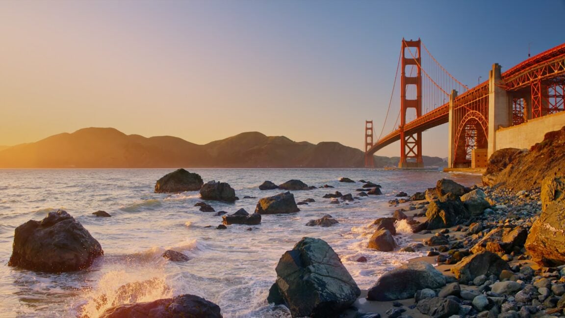 macOS Golden Gate default wallpaper, the Golden Gate Bridge at sunset