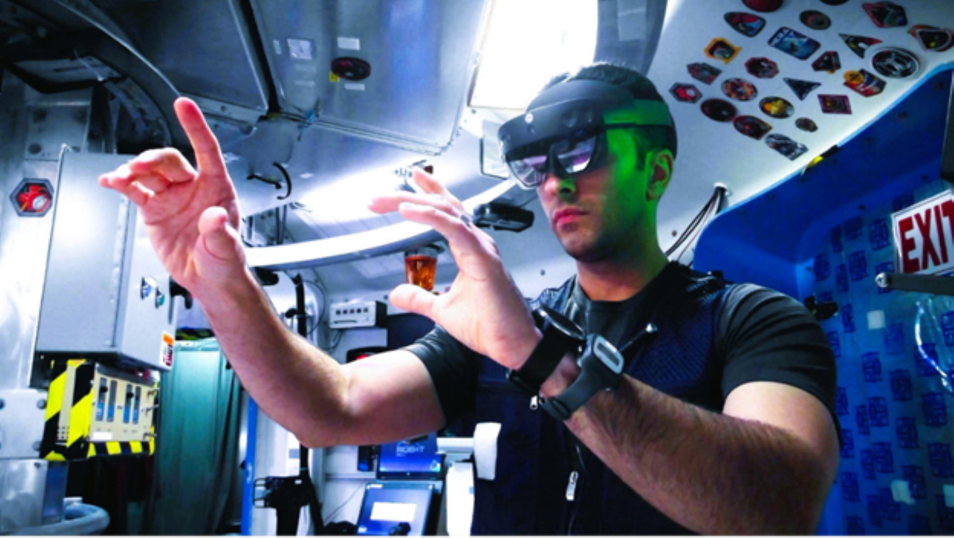A research volunteer uses augmented reality goggles to perform astronaut-like tasks during a simulated space mission