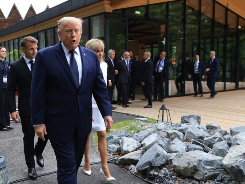 U.S. President Donald Trump walks after posing for a family photo photograph during a gala dinner as part of the G7 summit