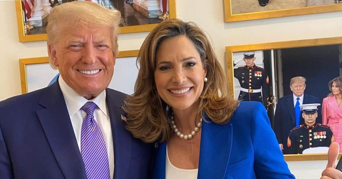 Donald Trump smiling next to woman giving a thumbs up