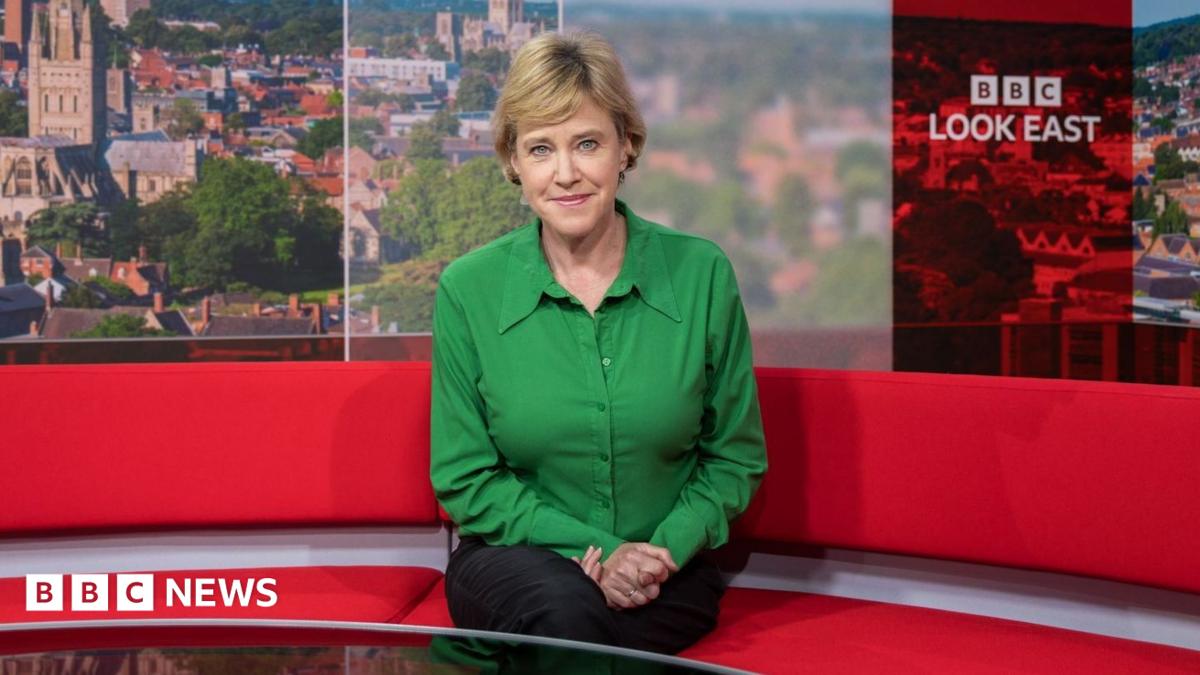 Susie Fowler-Watt sitting on the red sofa in the BBC Look East studio. She is looking directly at the camera and smiling