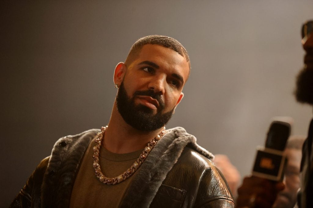 LONG BEACH, CALIFORNIA - OCTOBER 30: Drake speaks onstage during Drake's Till Death Do Us Part rap battle on October 30