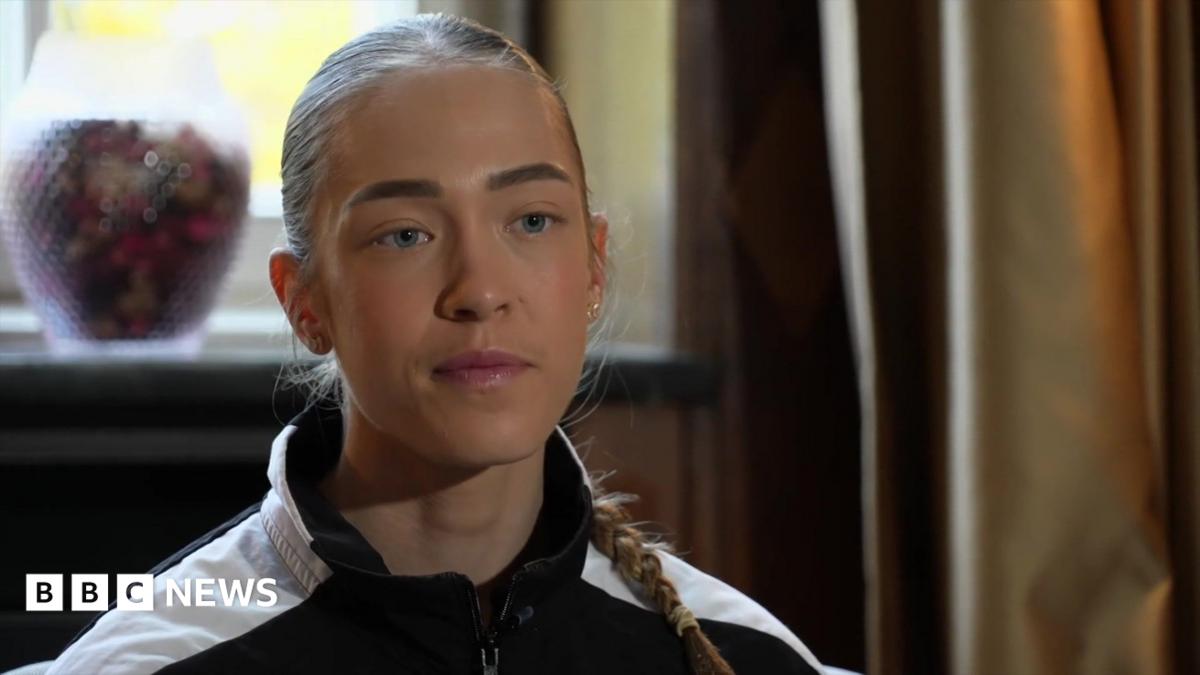 A young woman with hair in a pigtail