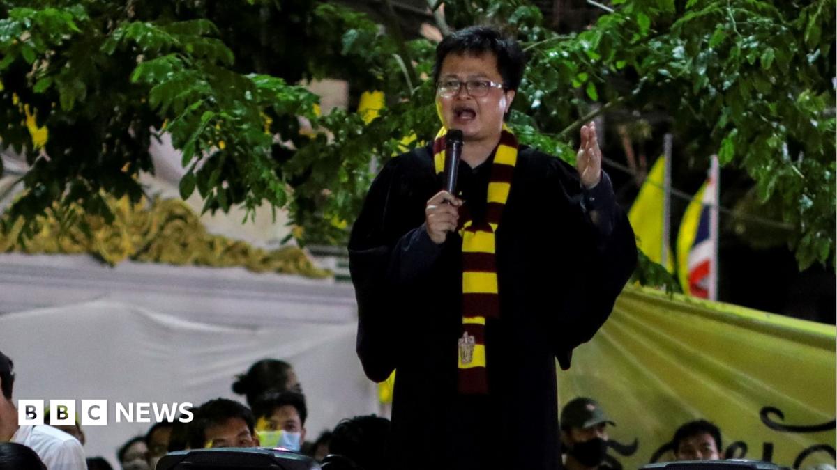 Arnon Nampa dressed as Harry Potter gives a speech at the protest in August 2020