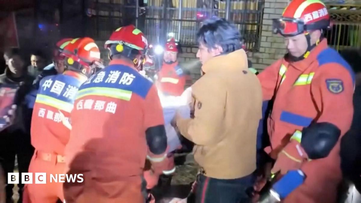 Firefighters and residents seen helping victims of the earthquake trapped under rubble