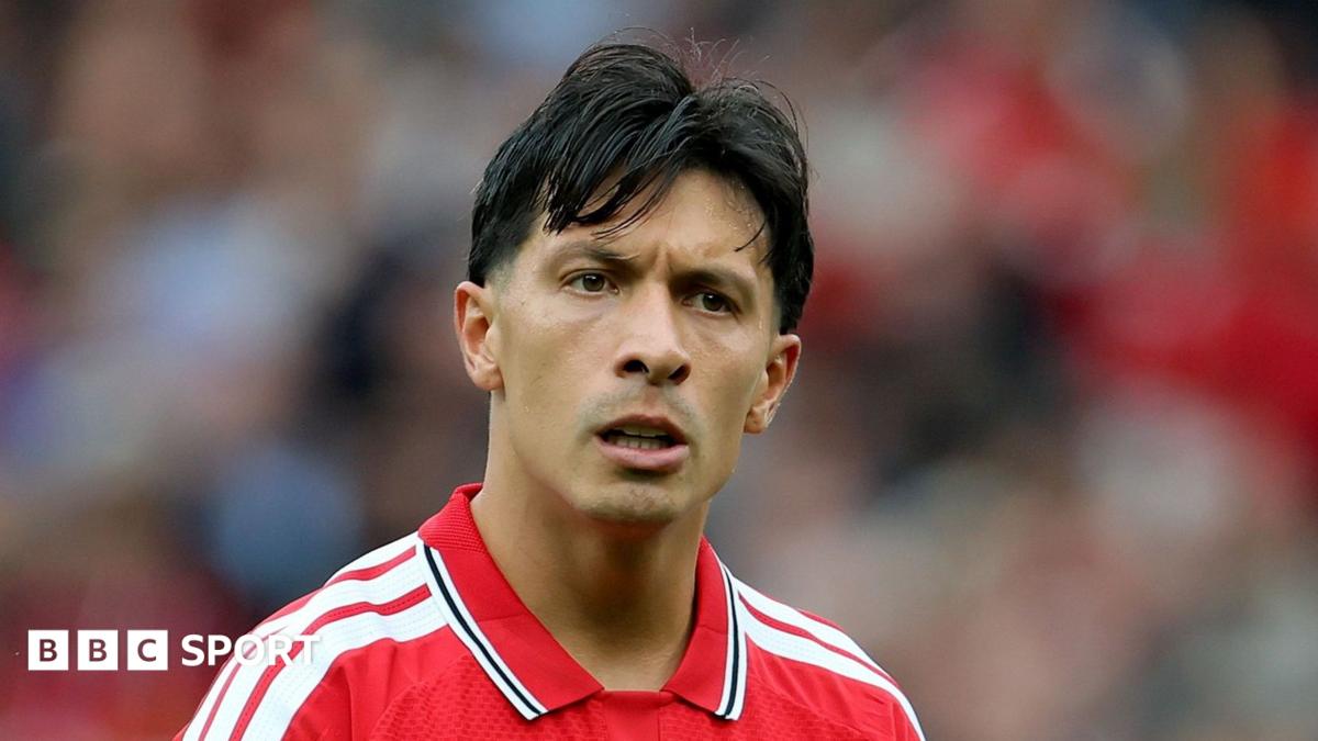 Lisandro Martinez wearing a red Manchester United home shirt