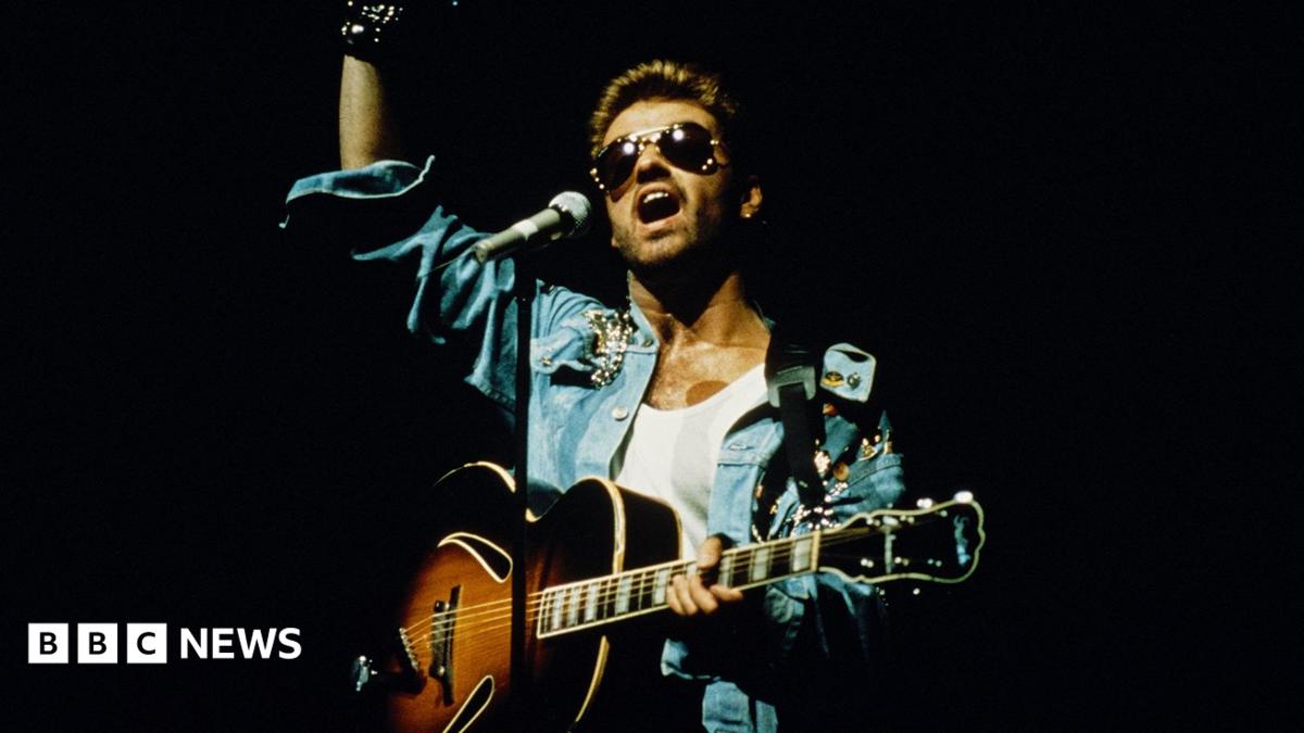 Singer and songwriter George Michael performing on stage during the Japanese/Australasian leg of his Faith World Tour