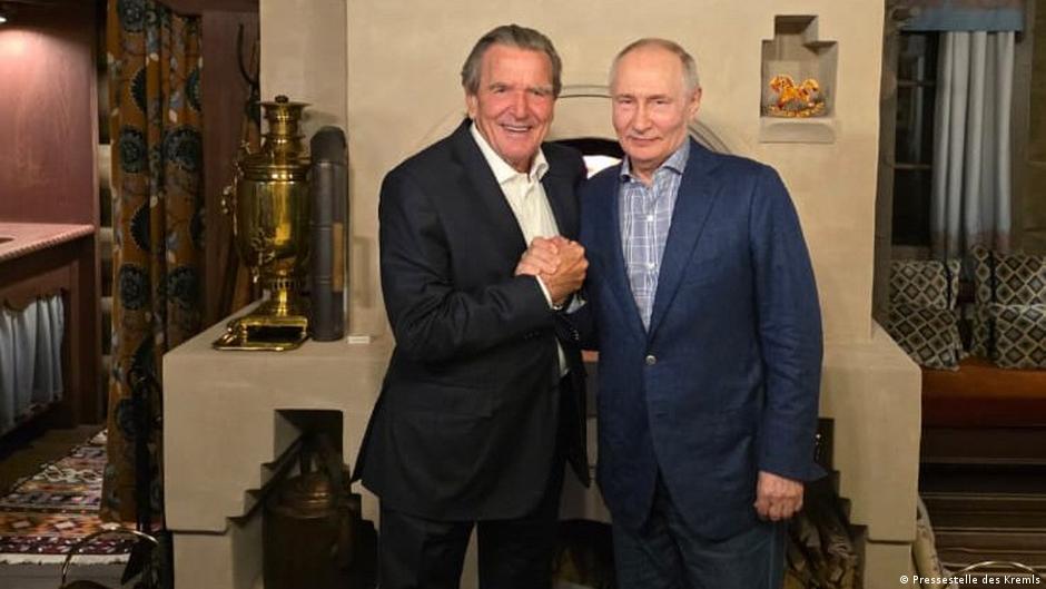 An official image from the Kremlin shows Schröder meeting Putin for his birthday