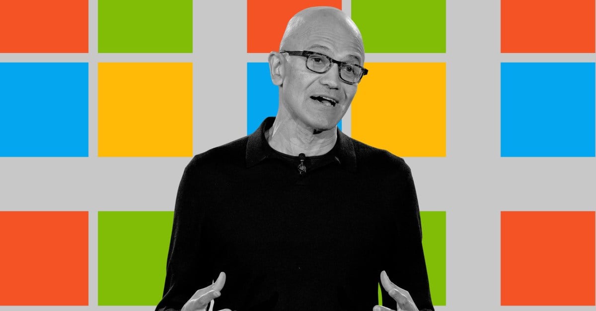 Satya Nadella on a graphic background of the Windows logo