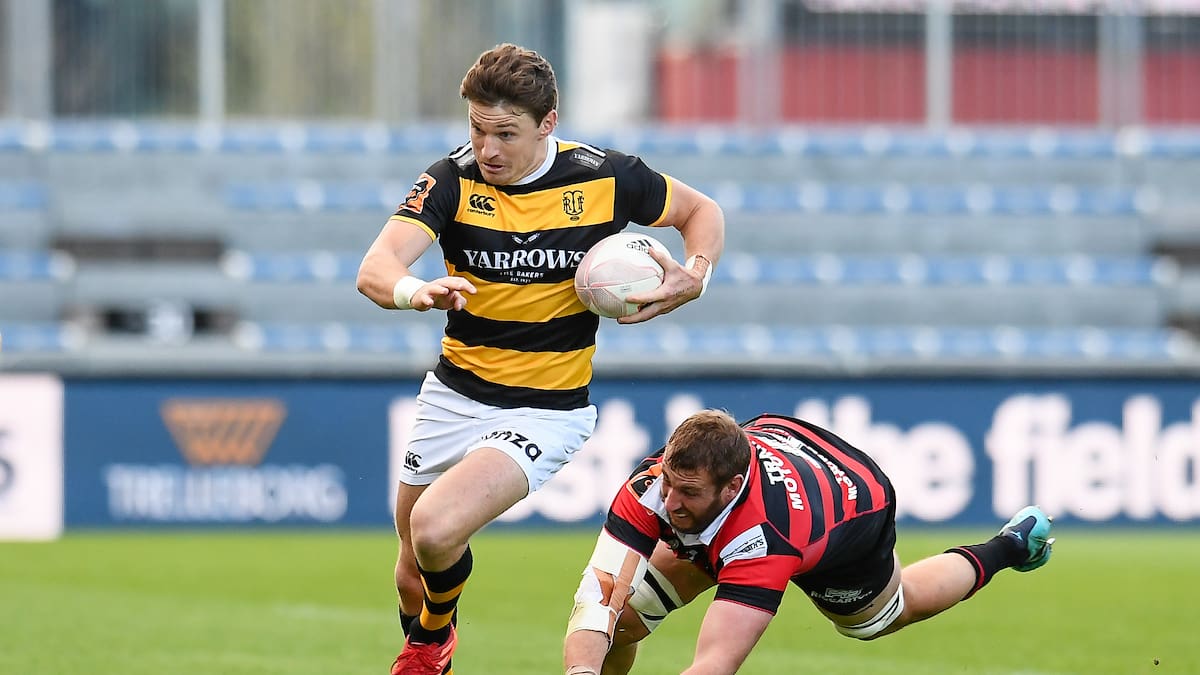 Beauden Barrett of Taranaki eludes Luke Romano of Canterbury during a 2020 Ranfurly Shield clash. Photo / Photosport