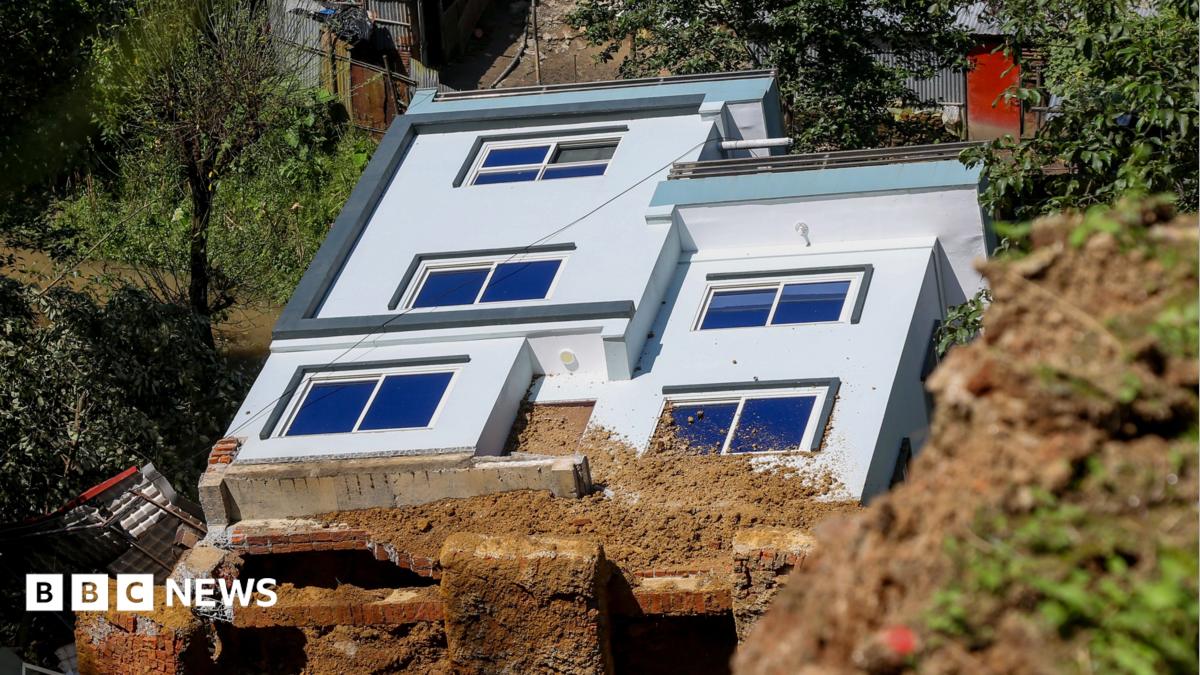 A damaged house is swept away by a landslide following heavy rains in Dhapakhel, Lalitpur, Nepal