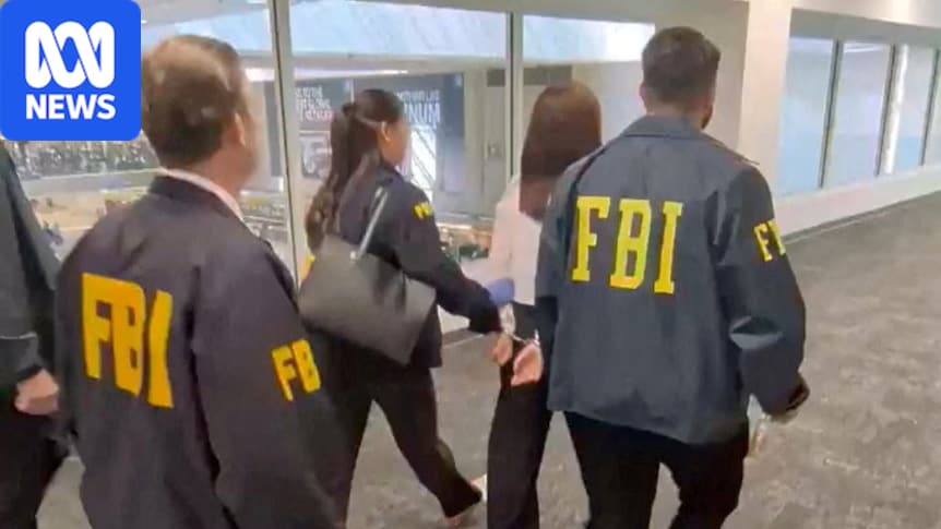 A woman is being led in handcuffs along a corridor, surrounded by three agents wearing jackets with FBI written on the back