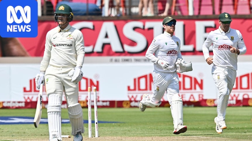 Nic Maddinson trudges off the ground with the stumps broken as South African fielders run forward in celebration