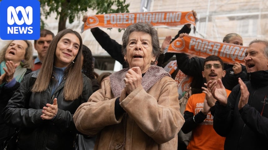 An older woman with younger people looking happy