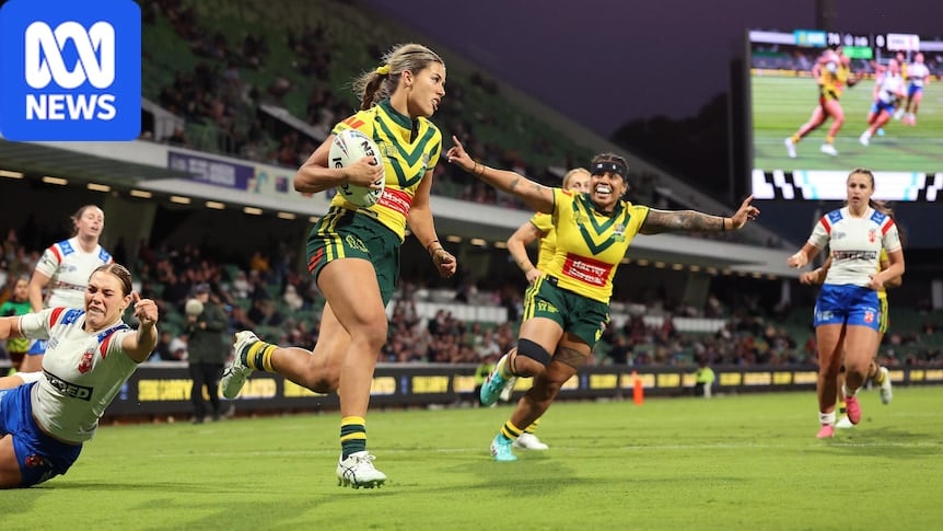 Shaylee Bent runs in a try for Australia against England as teammates cheer her on