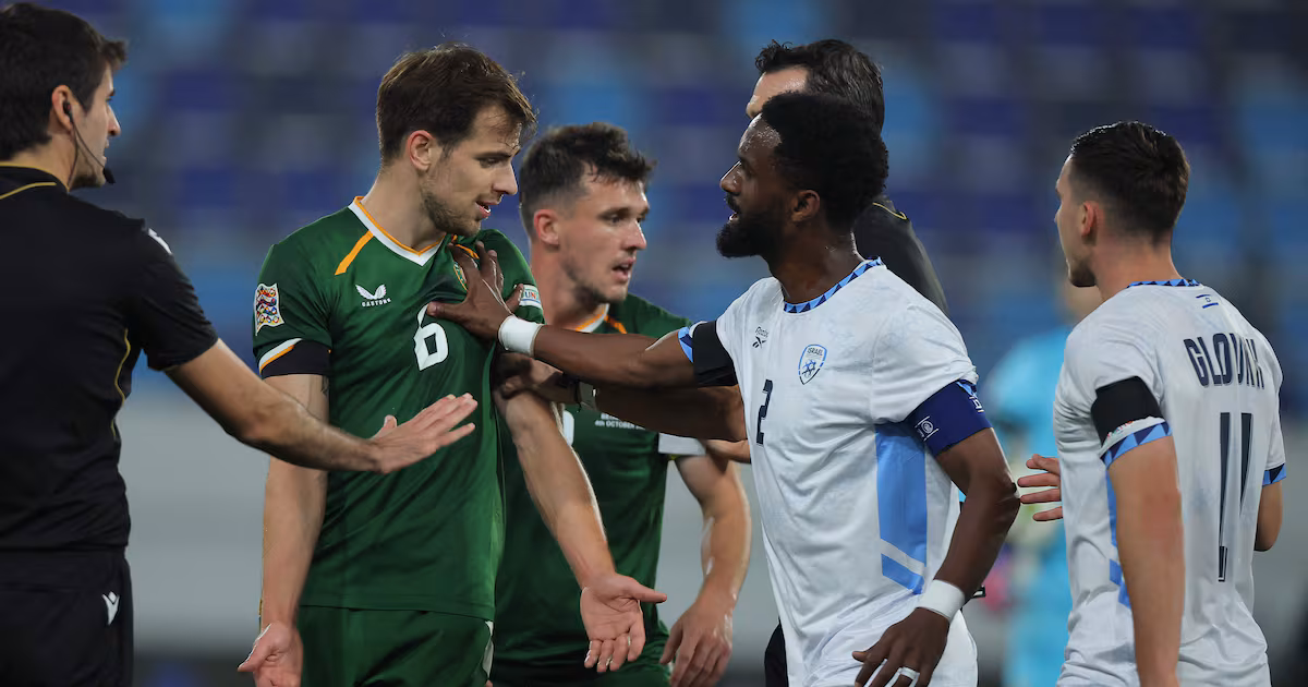 Israel's Eli Dasa, centre right, pushes Republic of Ireland midfielder Jayson Molumby during the Nations League match at the