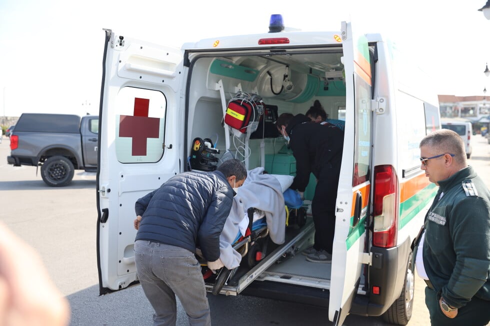 Bulgarian authorities take an injured crew member to a hospital after two commercial vessels were attacked in the NATO