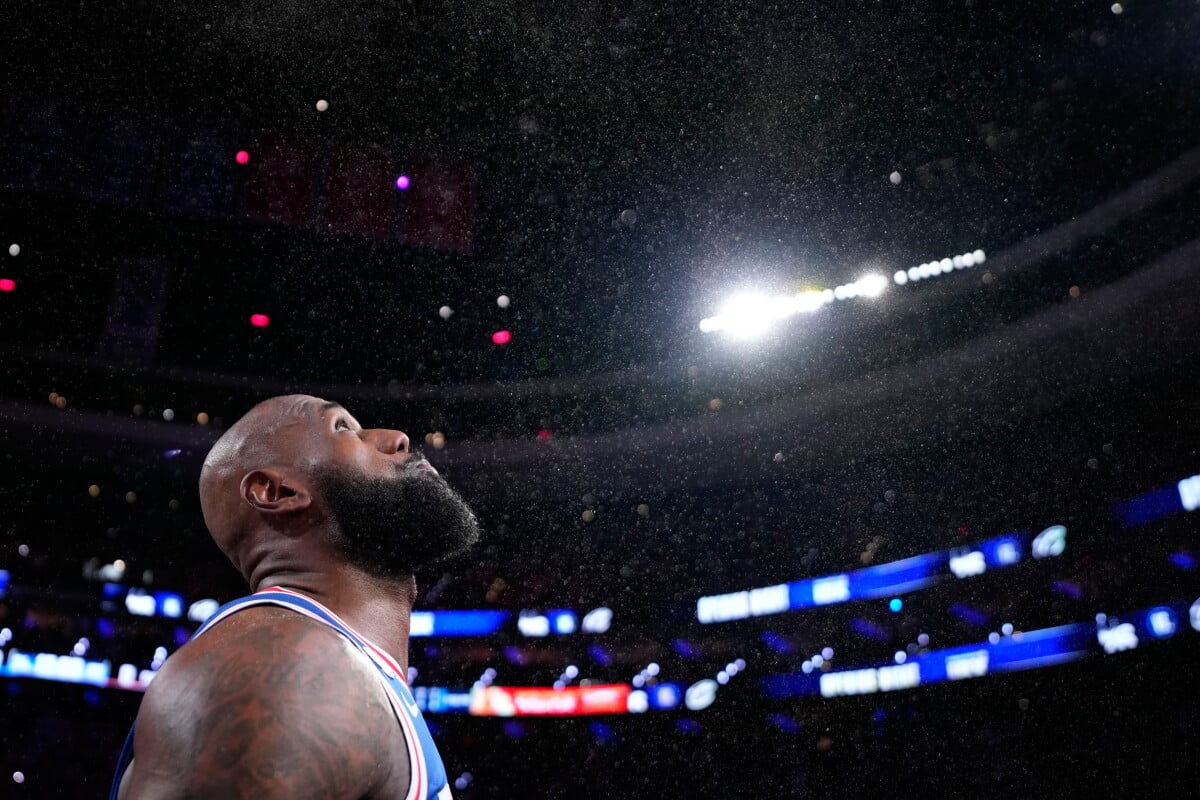 Philadelphia 76ers' LeBron James tosses chalk into the air before an NBA basketball game against the Cleveland Cavaliers