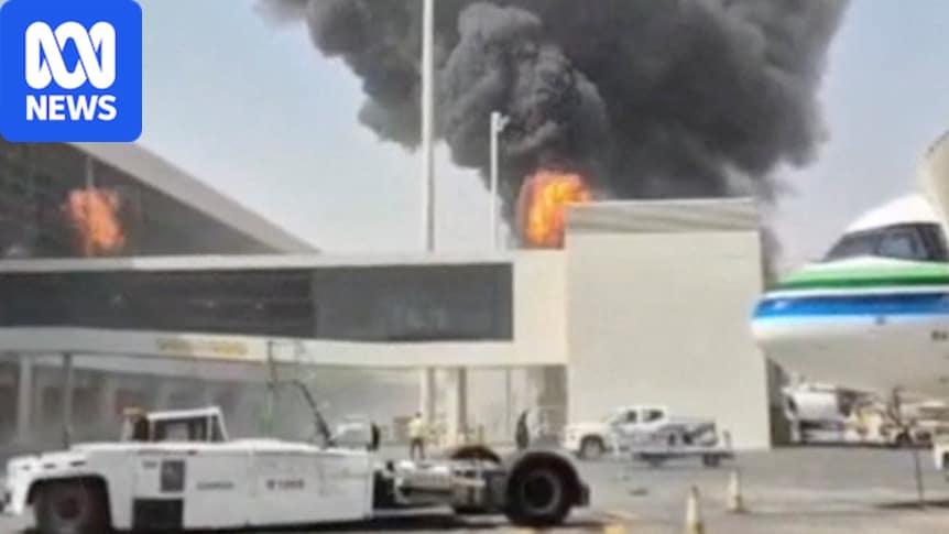 Smoke and flames rise from an airport terminal