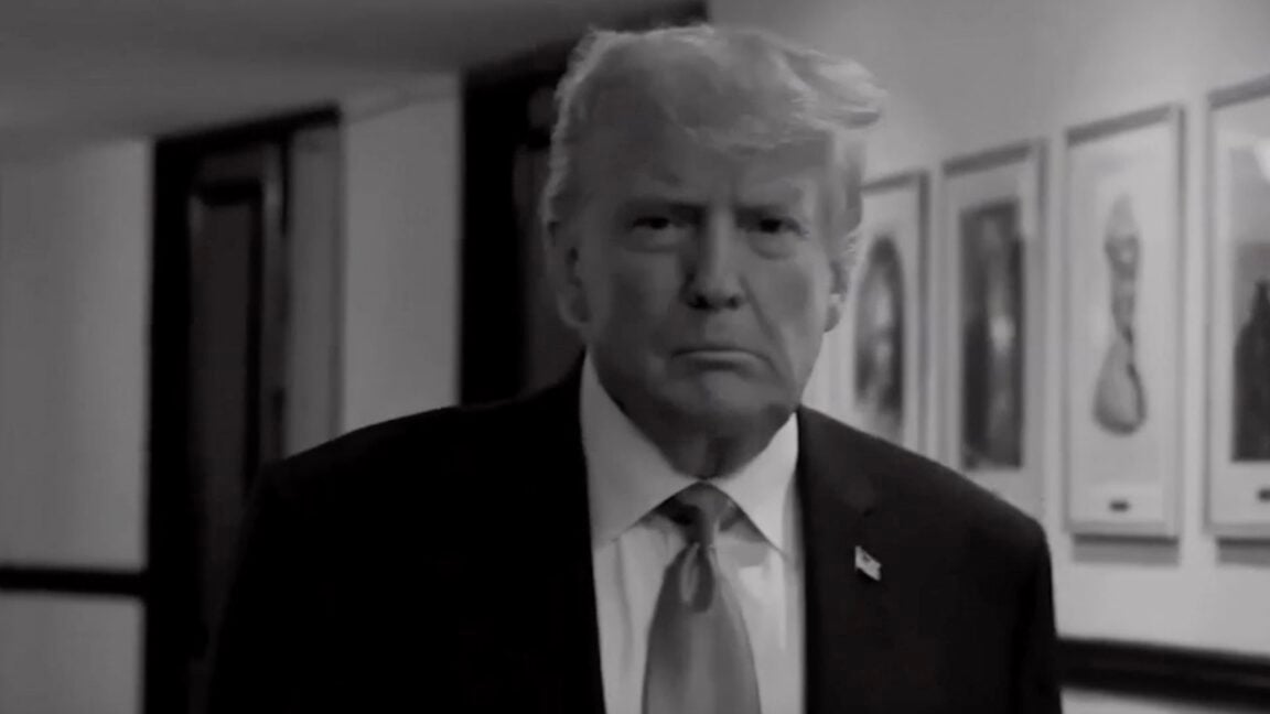 Trump walking down a hallway in a screenshot from a TV commercial